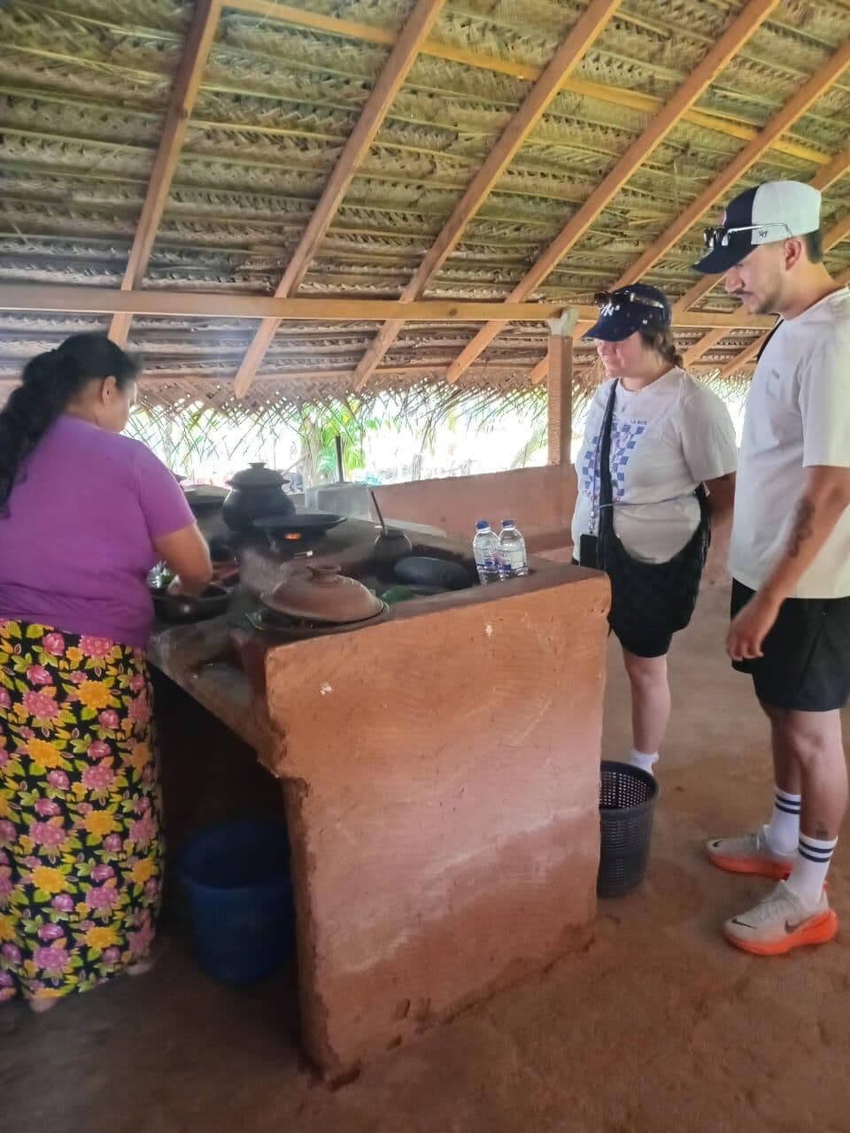 Village kitchen with clay pots over a wood fire