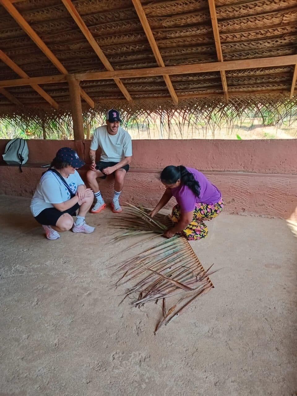 Palm-leaf weaving lesson in a village